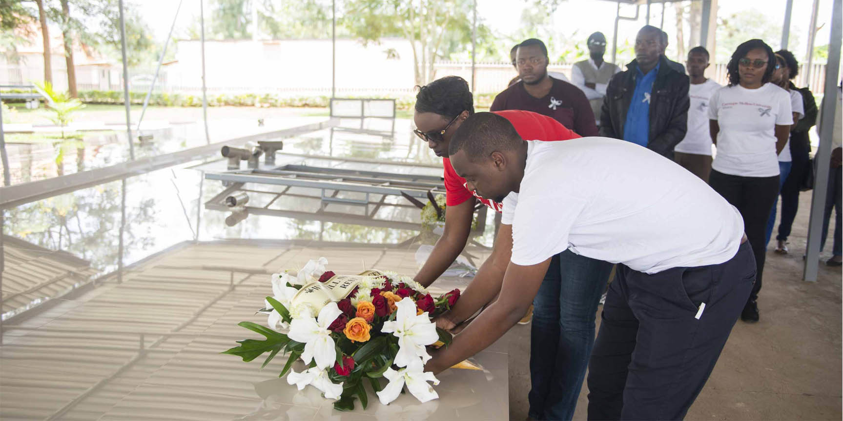 laying wreath of flowers at Nyamata genocide memorial site