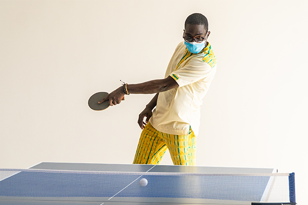 Student playing ping pong