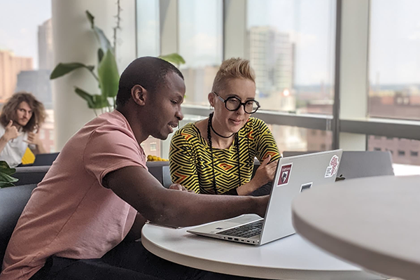 Two people at a computer