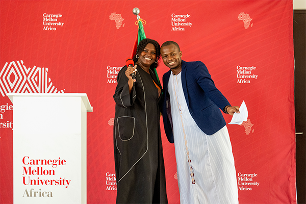 Two students at a podium