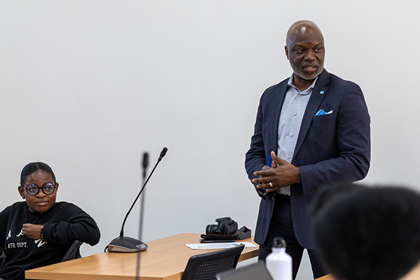 man presenting to classroom