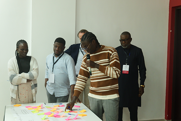Four Africans around a table with post-it notes