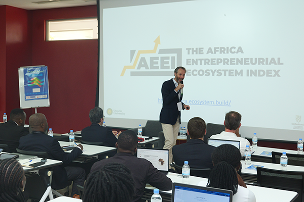 A man presents to a room of people