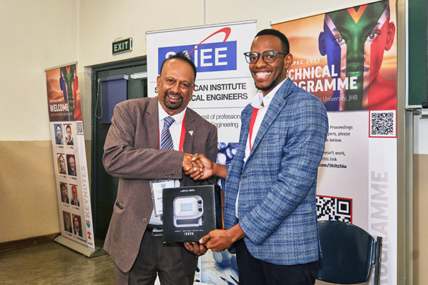 Two men shaking hands are a poster board presentation