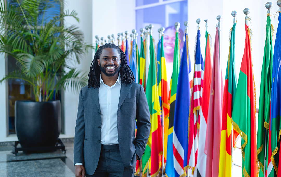 Stewart Isaacs standing with flags