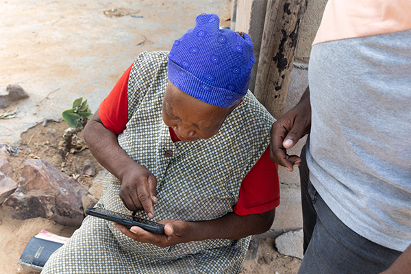 Woman using phone in Africa