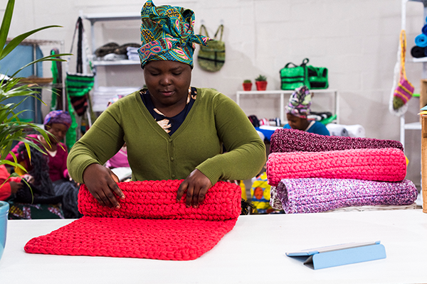 Woman in shop packing up order