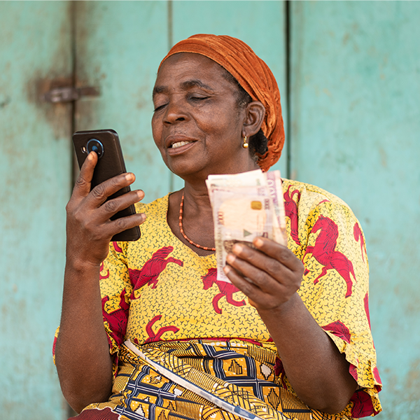 Woman on phone holding money